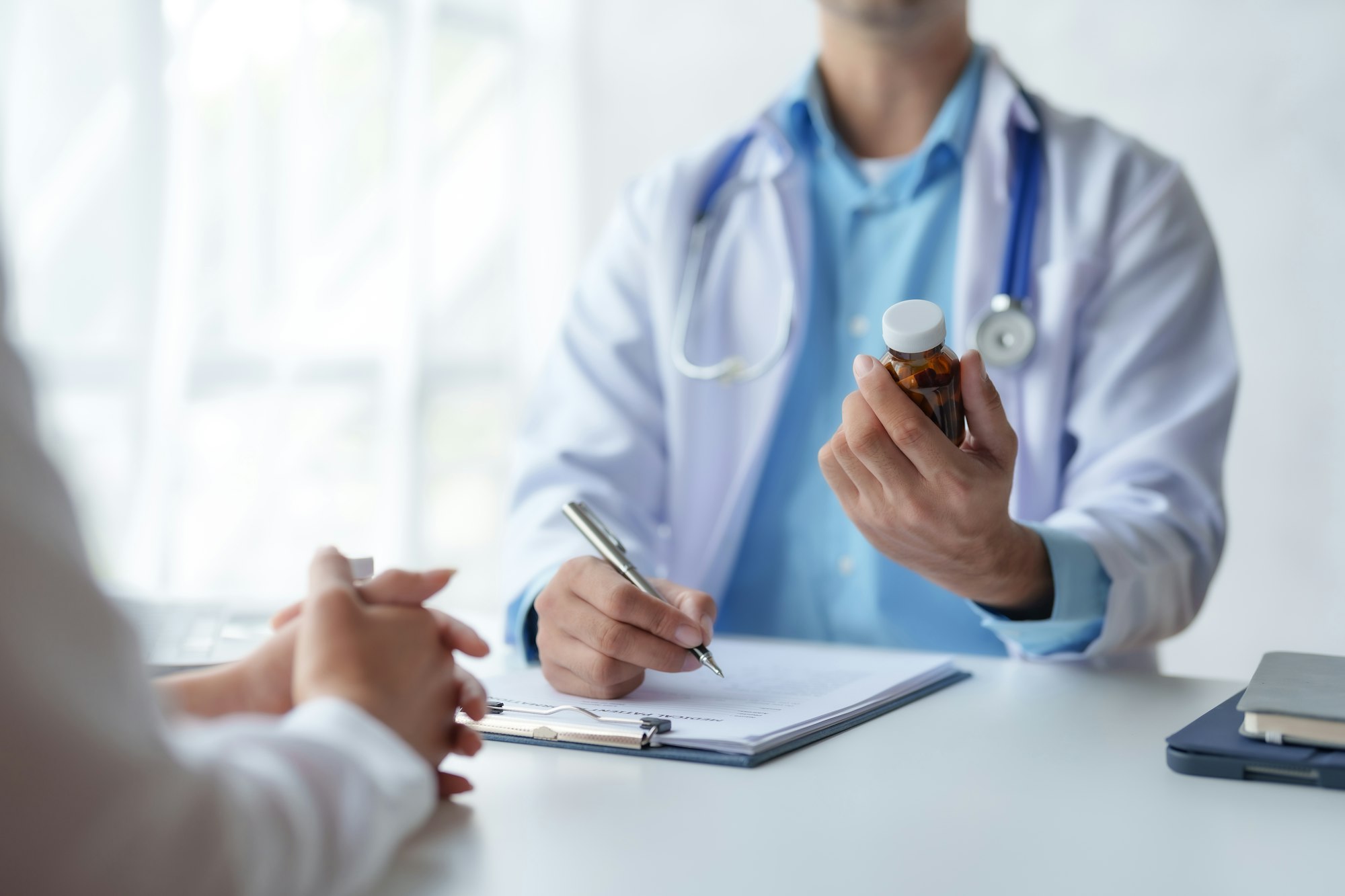 Doctor who records a patient's detailed information or medication history is evaluating medications